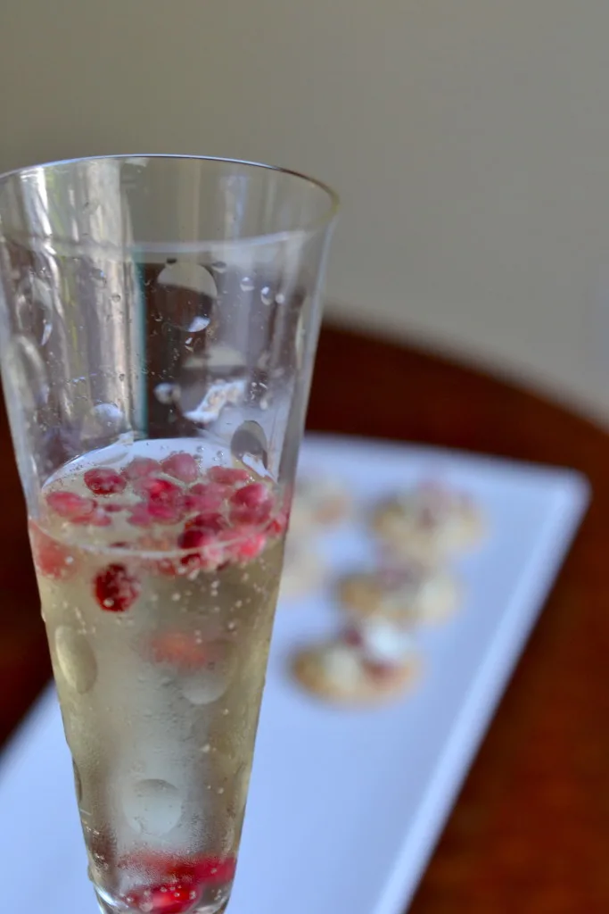 Turn ordinary champagne or sparkling wine into a festive holiday cocktail just by adding a handful of pomegranate seeds. #partylikeapro #ad #samsclub
