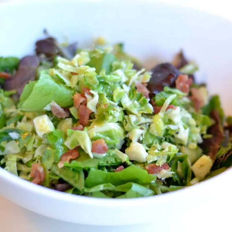 Brussels sprouts salad with bacon and arugula