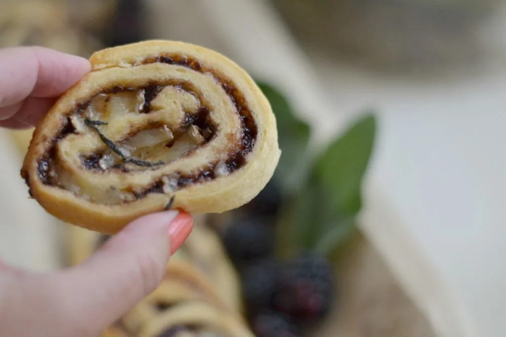 Close up of brie and blackberry pinwheel