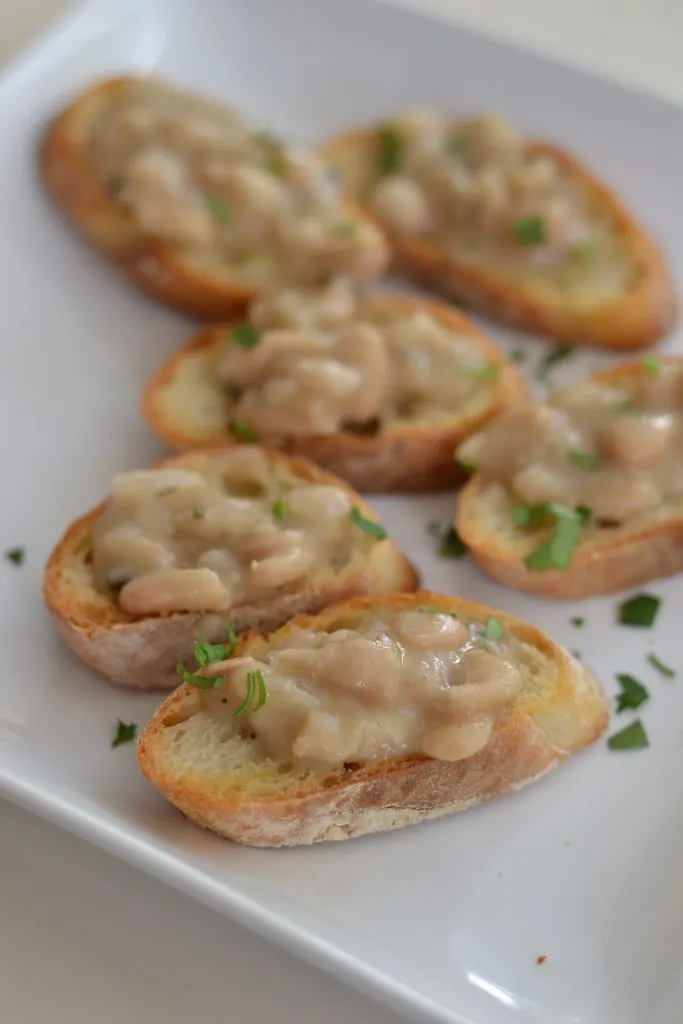 Rosemary white beans on top of toasted crostini