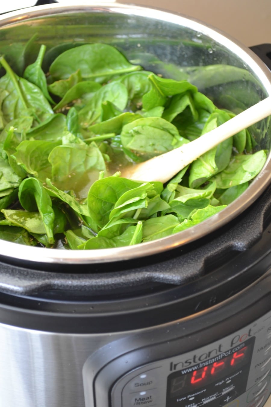 Adding fresh spinach to the Instant Pot after pressure release