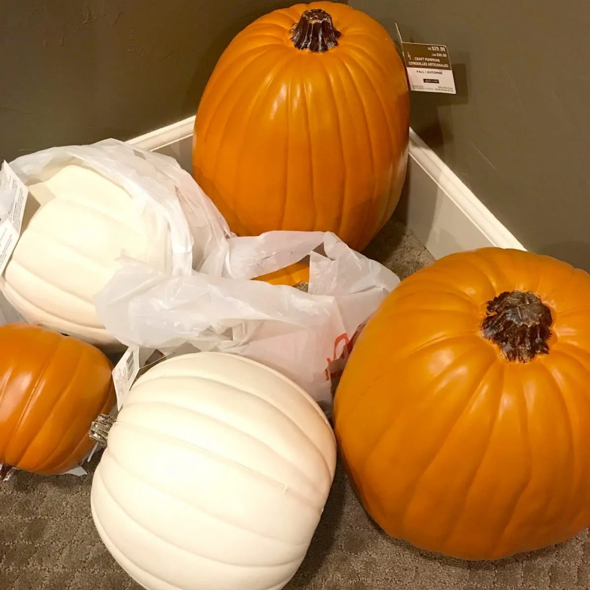 Assortment of white and orange craft pumpkins.