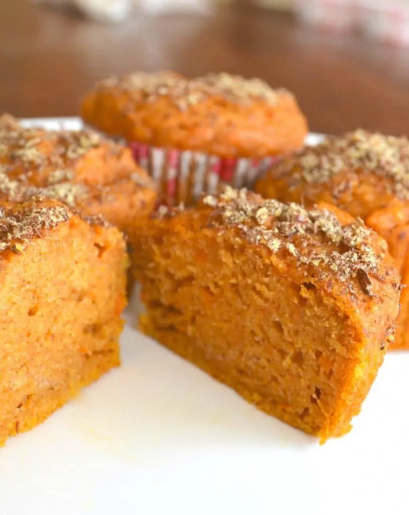 Moist inside of a sweet potato muffin topped with flax seed