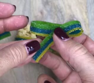 Folding candy strip to make a ribbon