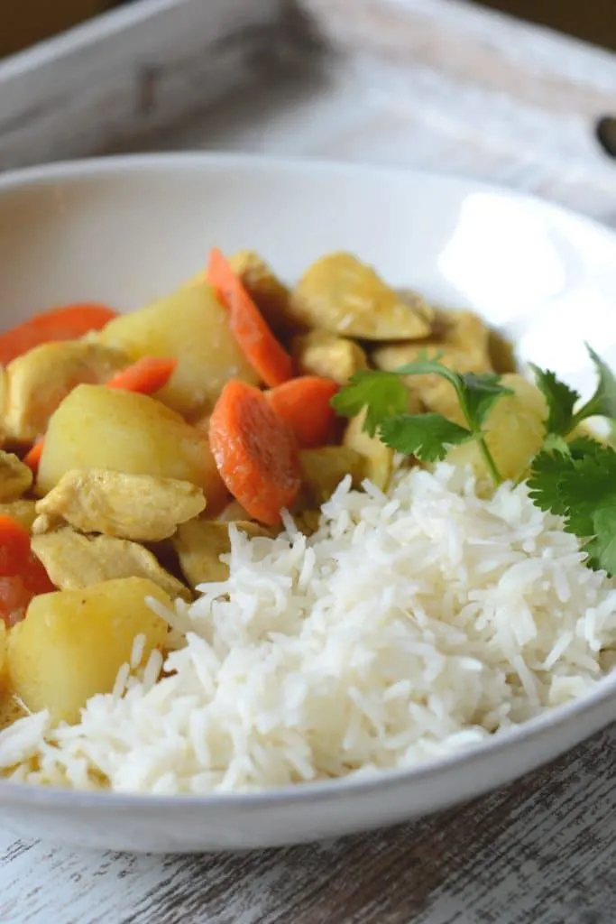 Homemade Thai curry served with jasmine rice and cilantro