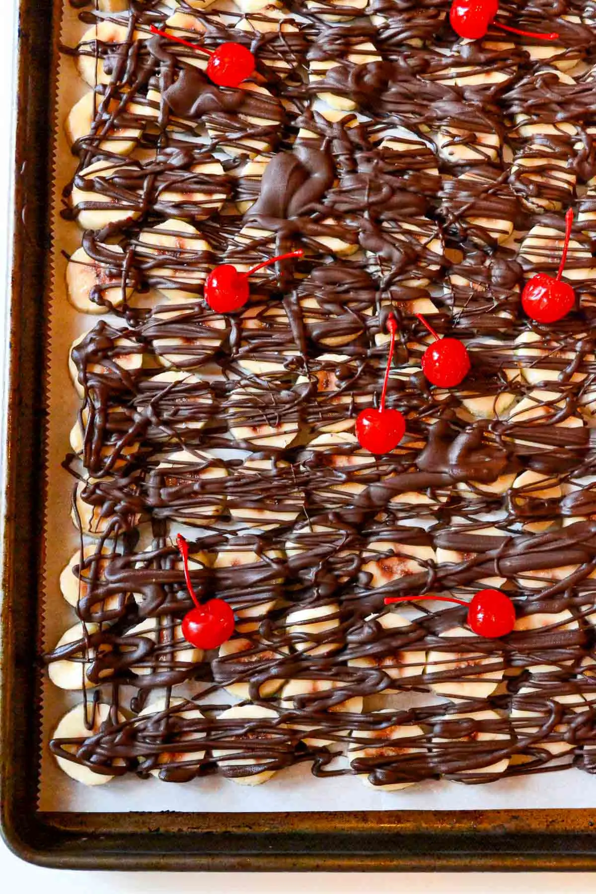 Tray of banana slices with chocolate