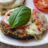 Healthier eggplant parm with fresh tomato.