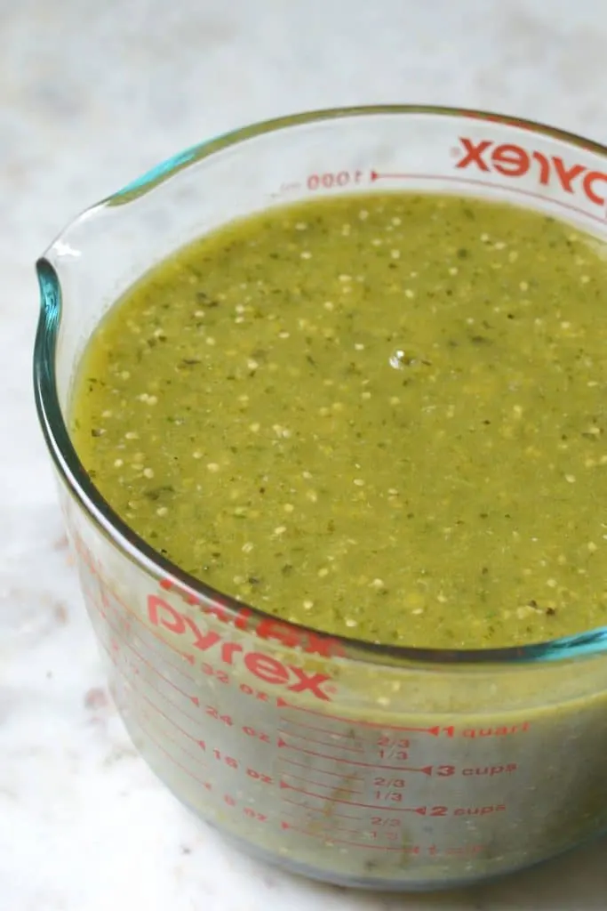 Blended stew ingredients in a measuring cup.