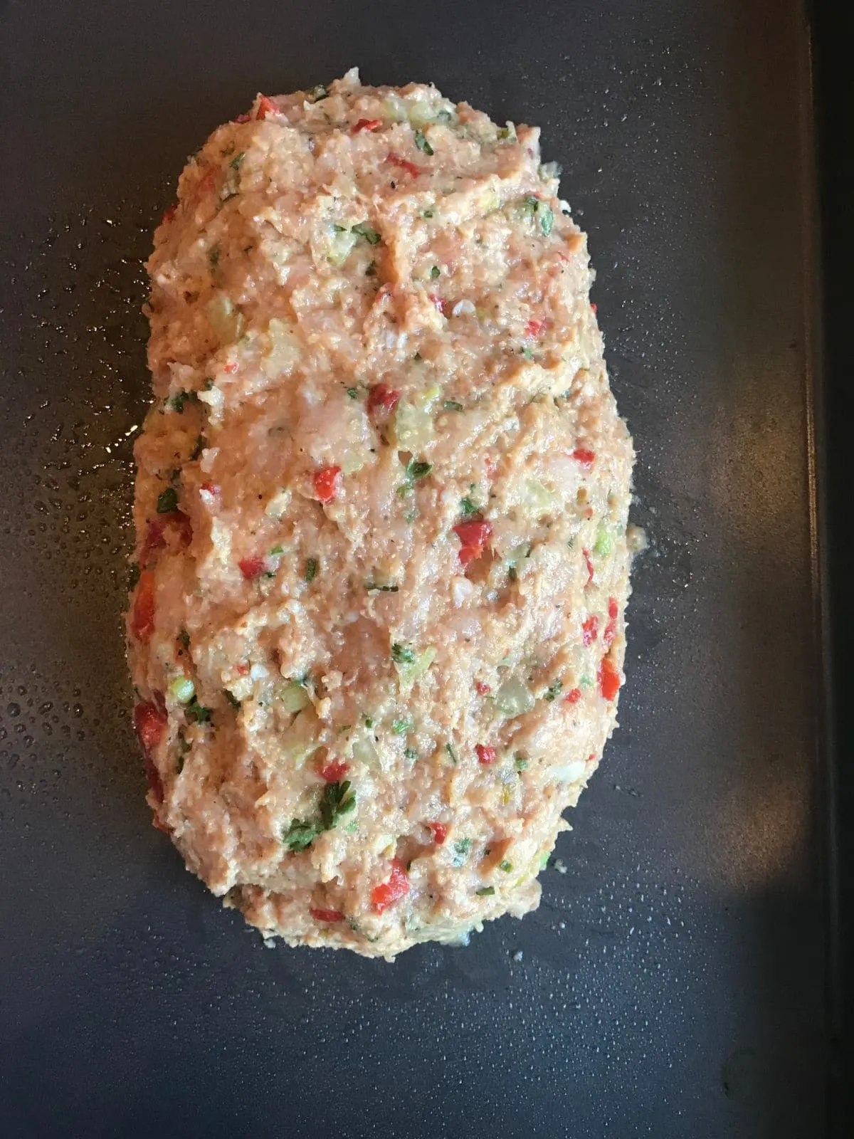 Turkey meatloaf shaped into a loaf and ready to go into the oven