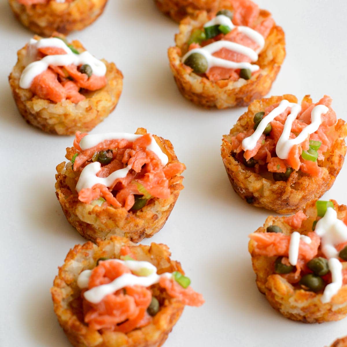 Smoked salmon in tater tot cups appetizer.