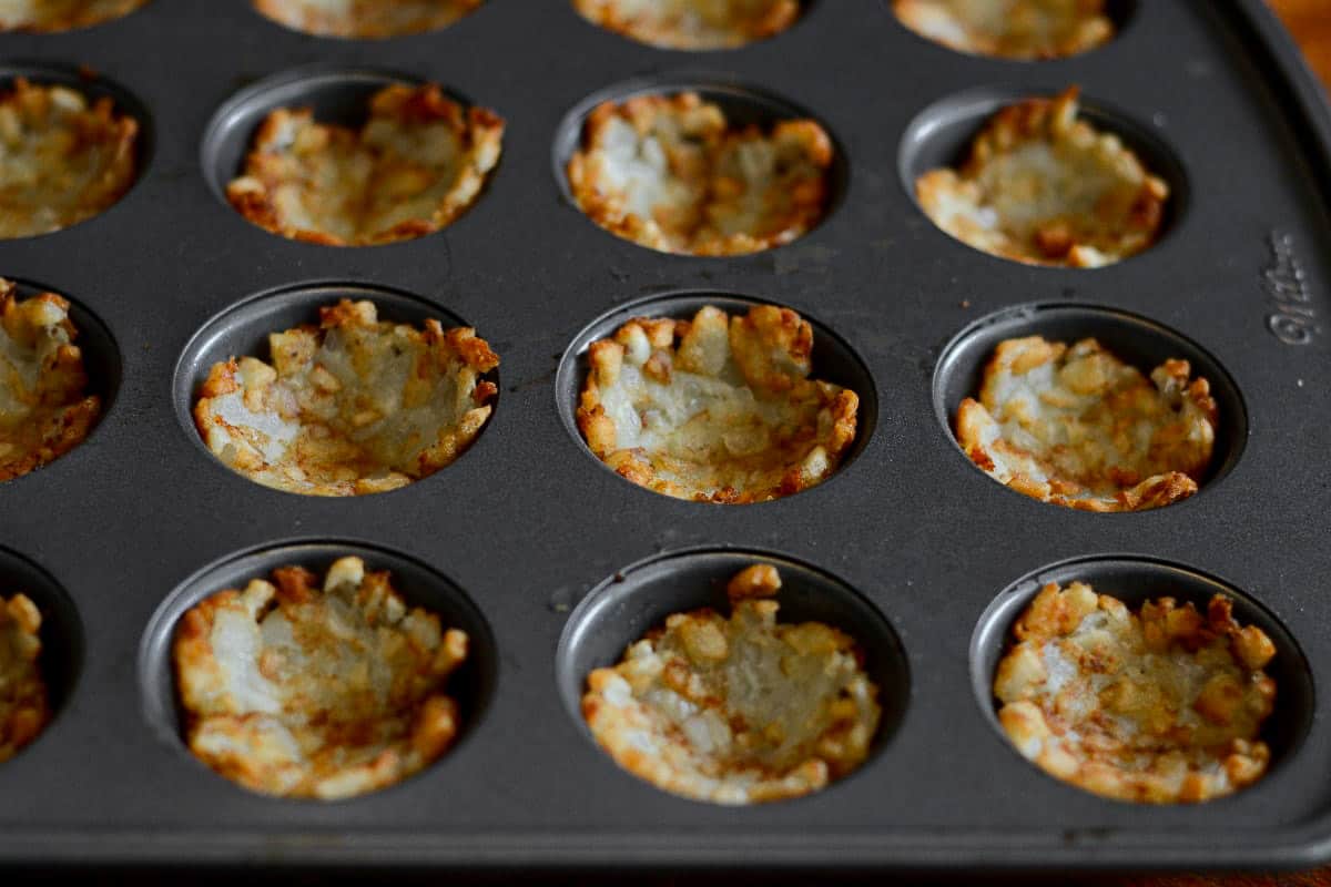 Baked tater tots in a mini muffin pan.