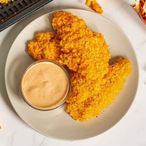 Plate of cheetos chicken with dip