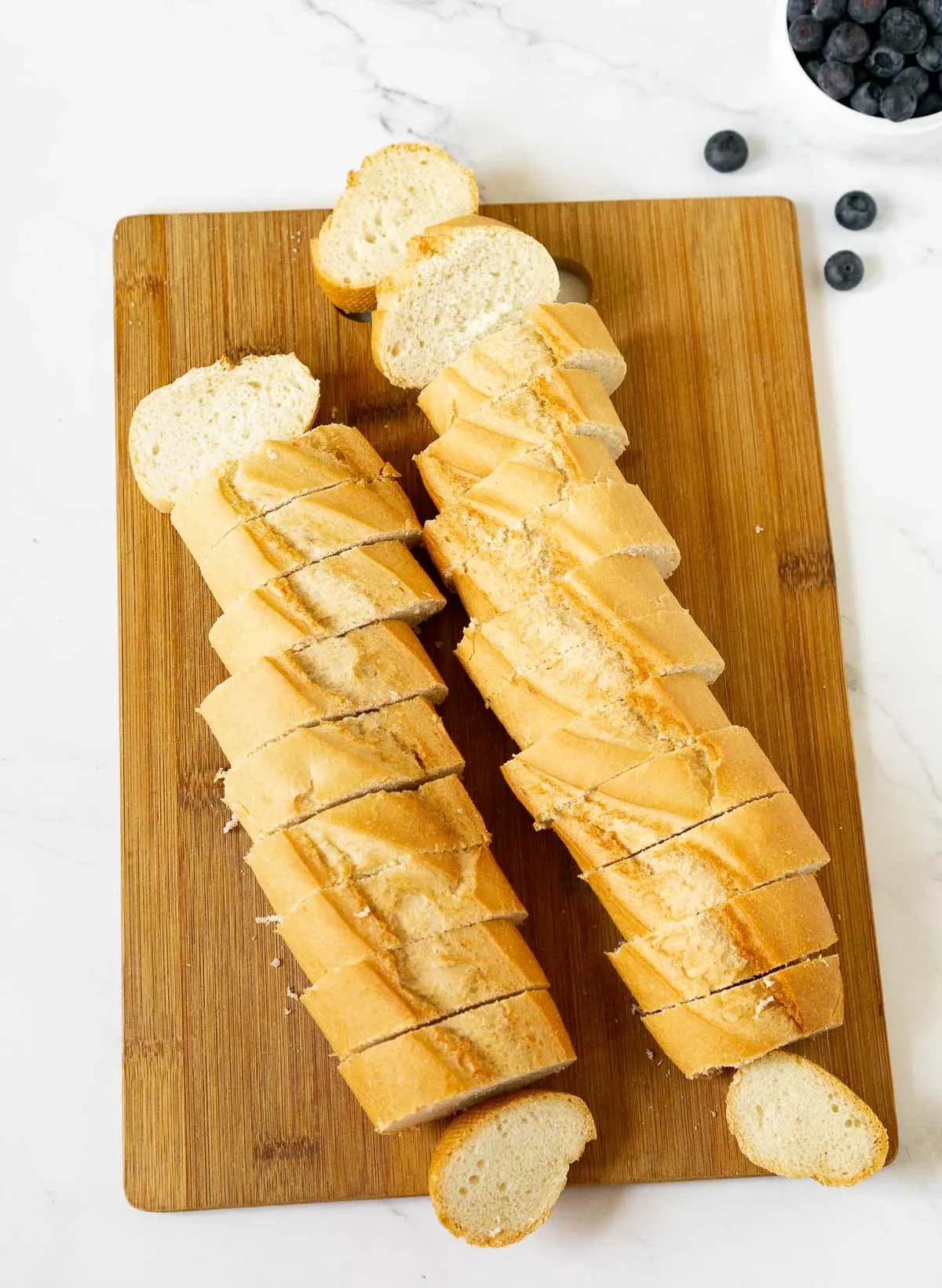 Sliced baguette on a cutting board