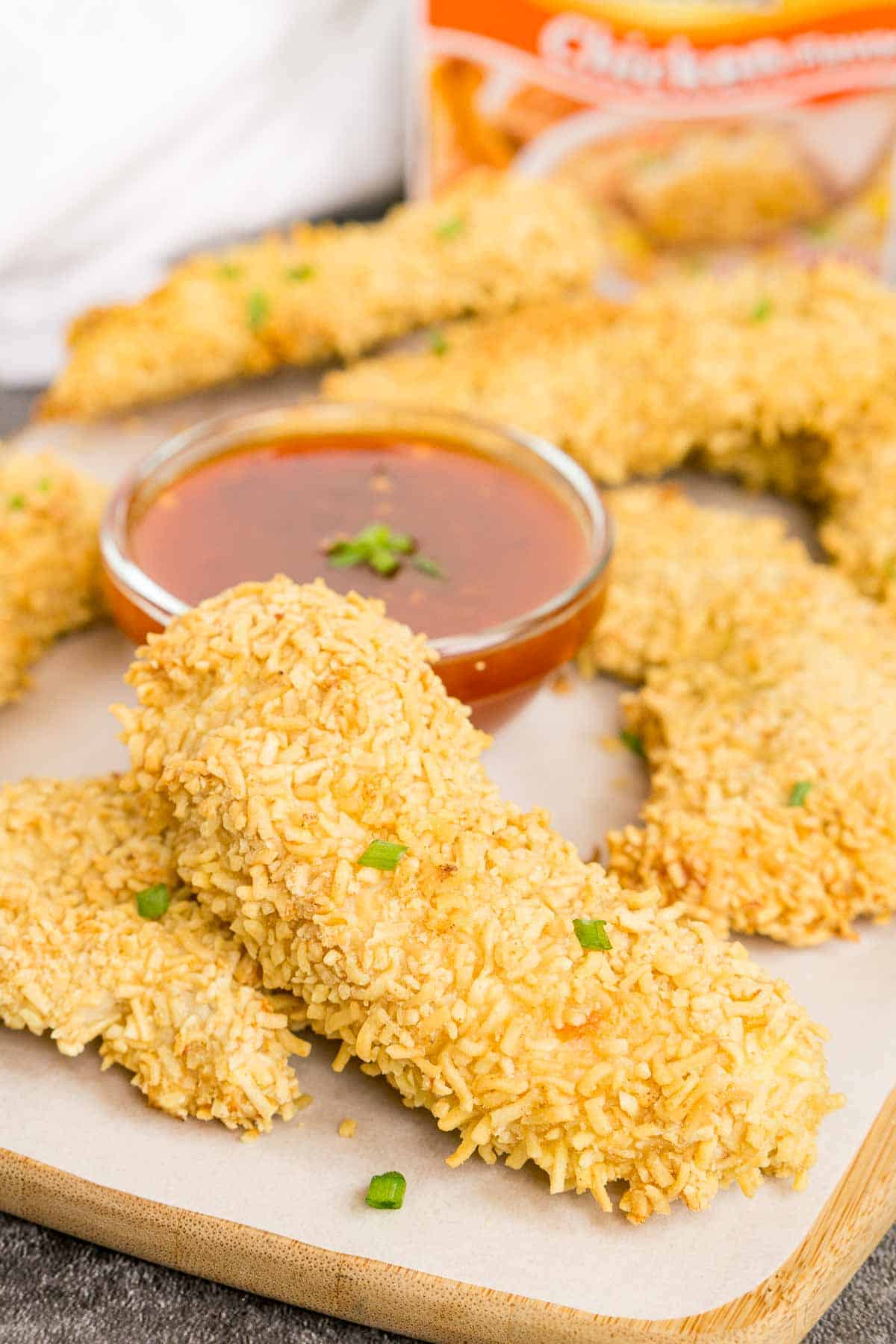 Crispy ramen fried chicken tender on a serving tray
