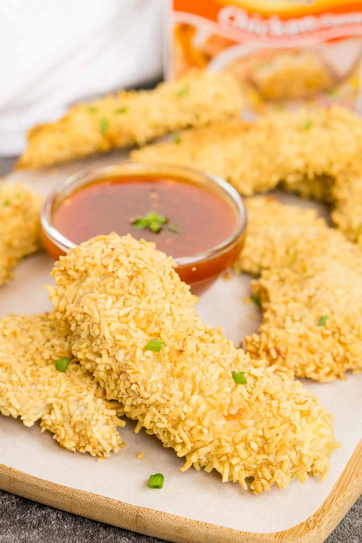 Crispy ramen fried chicken tender on a serving tray