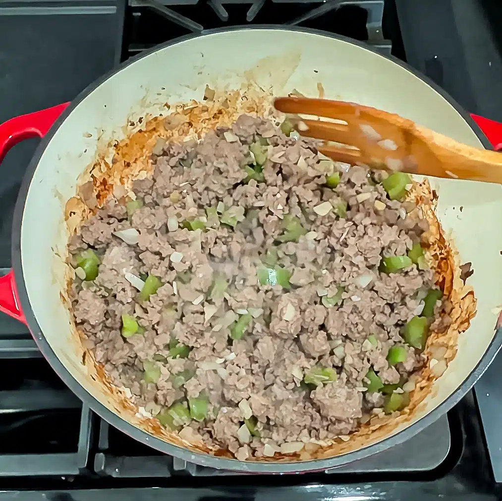 Browning ground venison in a large pot