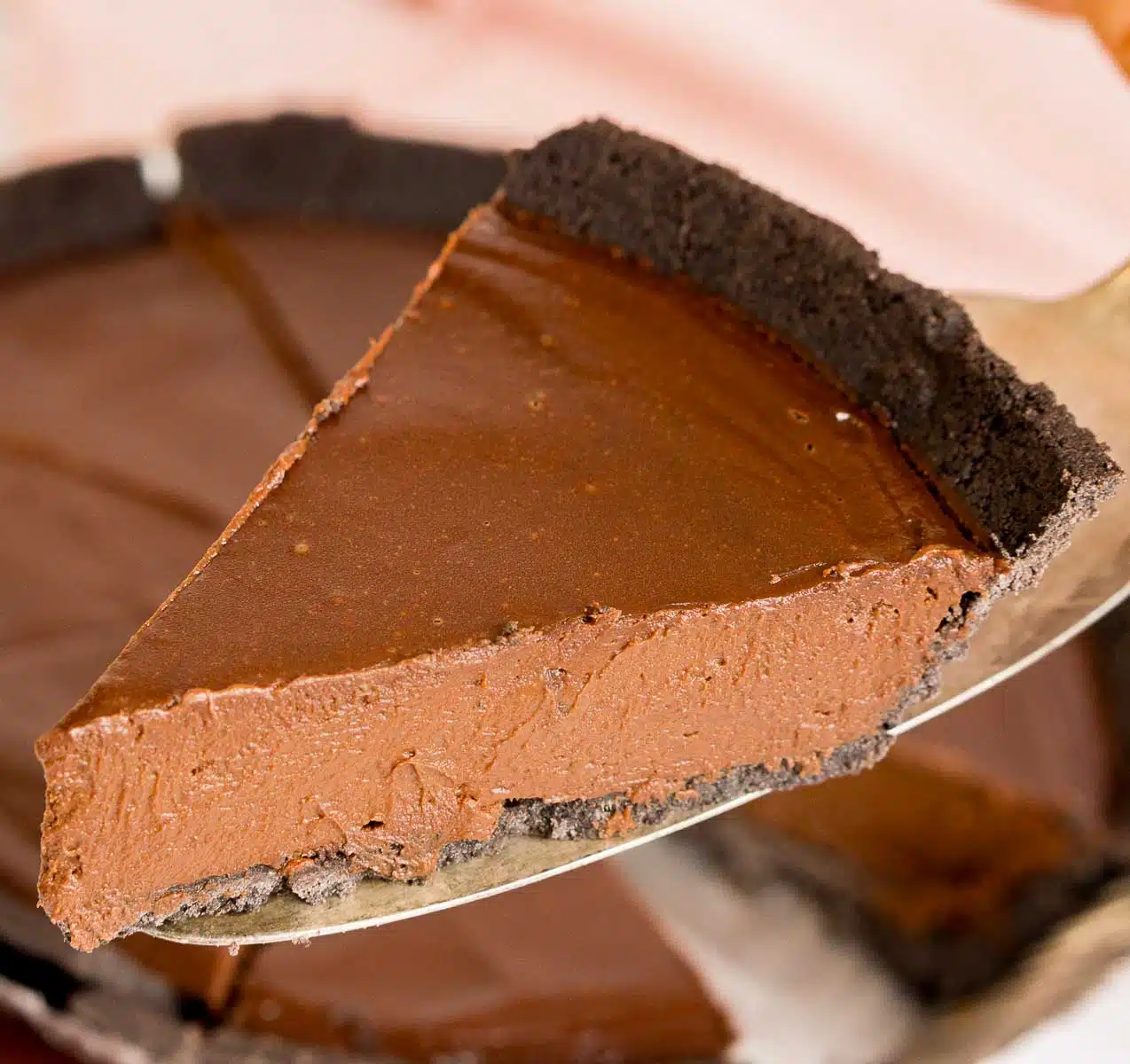 Slice of no bake chocolate pie on a serving utensil