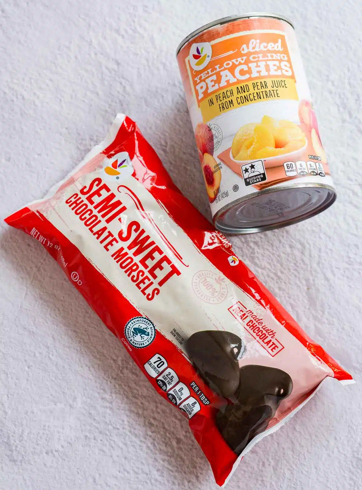 Canned peaches and a bag of chocolate chips
