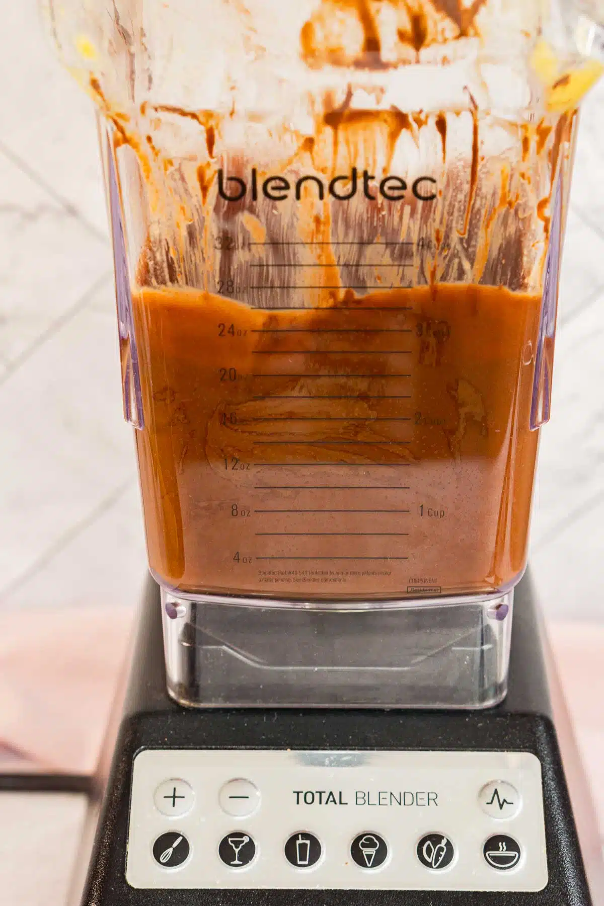 Blended peaches and melted chocolate in a blender
