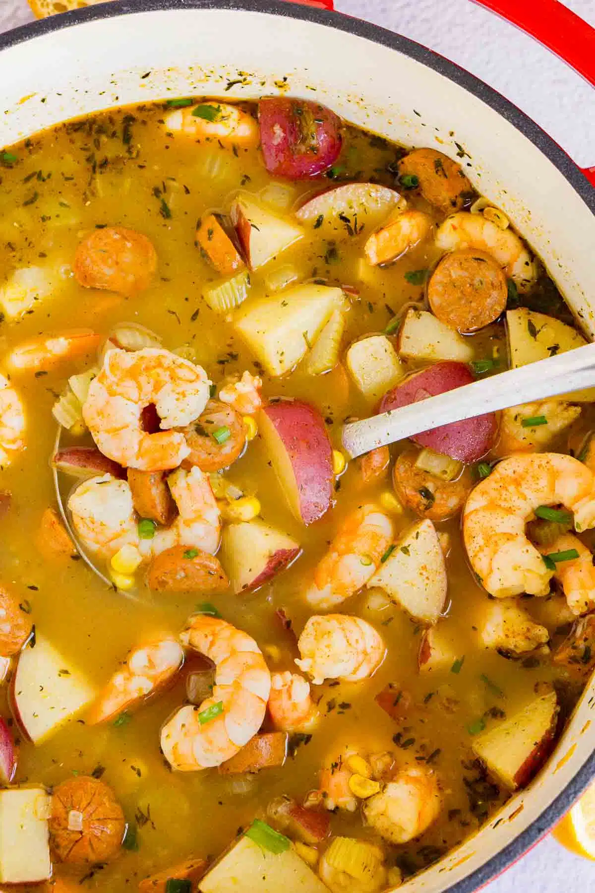 Close up of a pot of shrimp boil soup