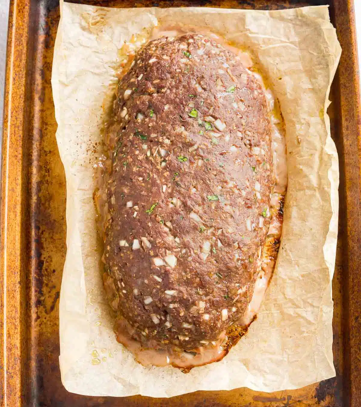 Baked venison meatloaf on a baking sheet