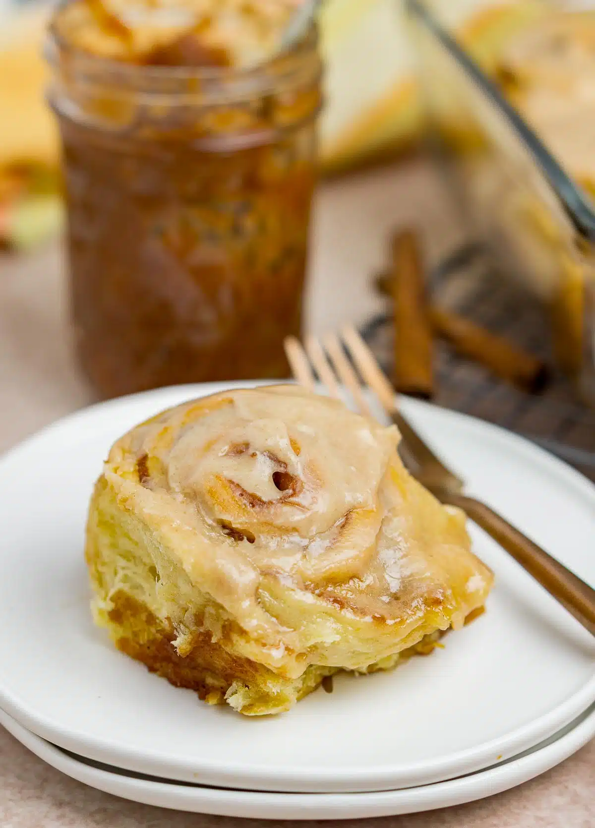 apple butter roll with icing on a plate
