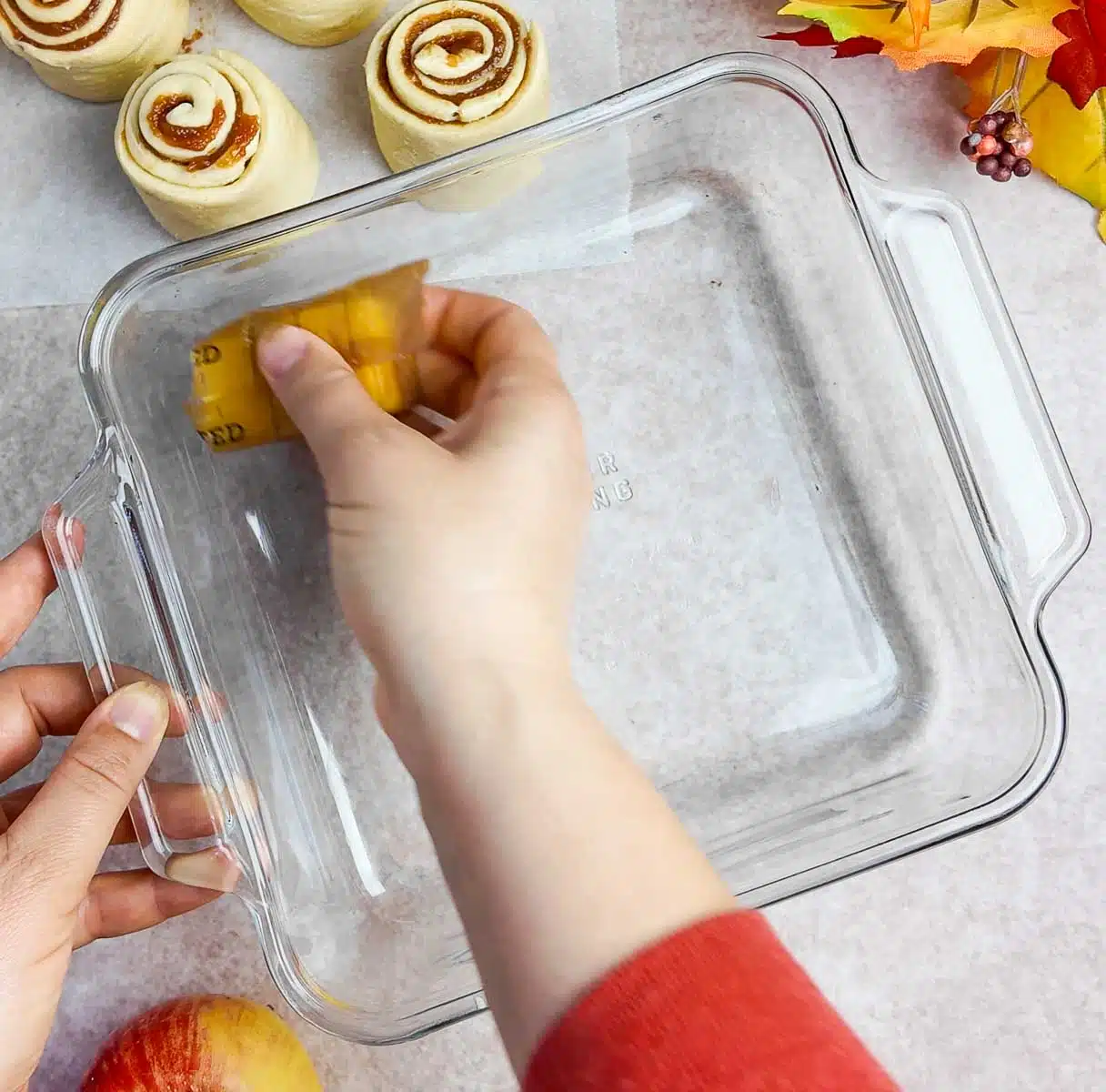 Buttering an 8x8-inch baking dish